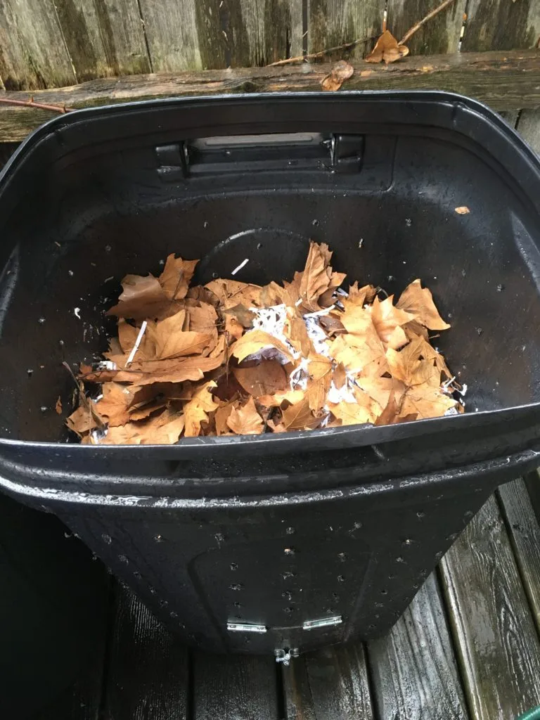 home compost bin with shredded plates